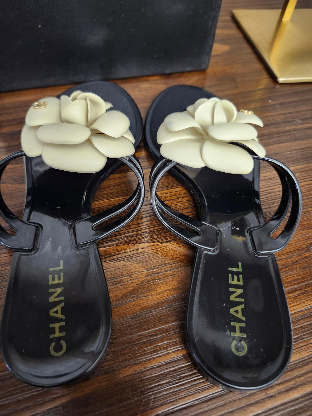 Chanel Black Jelly Camellia Sandals in Size 36 featuring Gold Tone CC Logo on the Flower