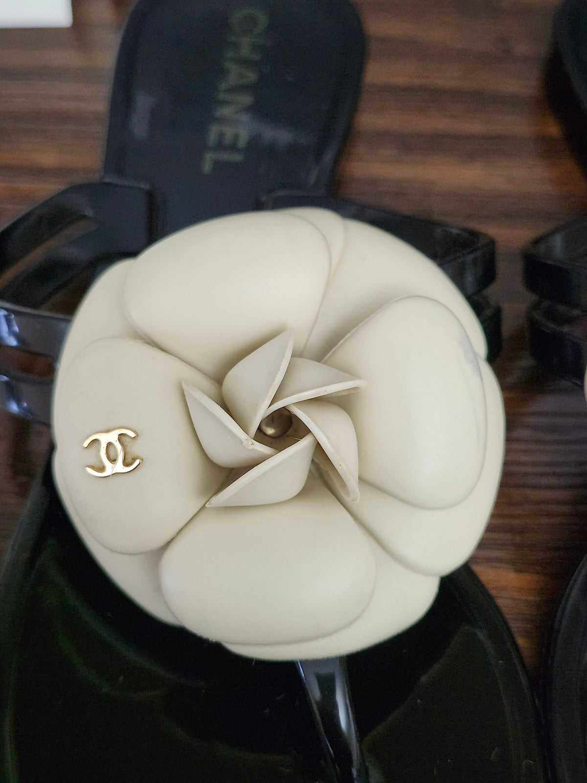 Chanel Black Jelly Camellia Sandals in Size 36 featuring Gold Tone CC Logo on the Flower