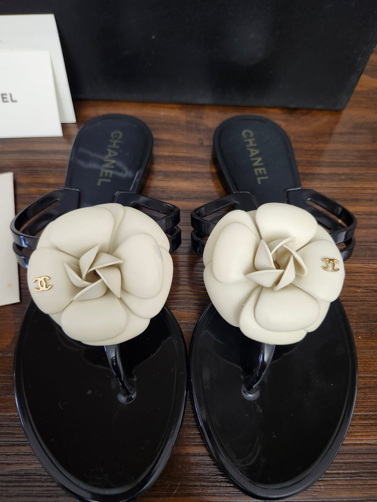 Chanel Black Jelly Camellia Sandals in Size 36 featuring Gold Tone CC Logo on the Flower