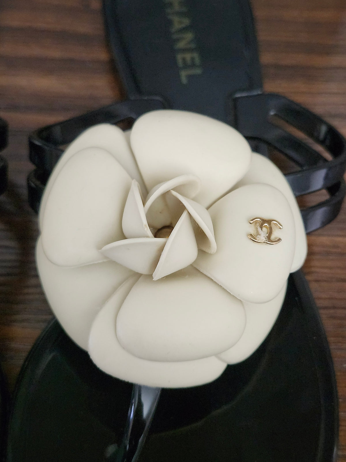 Chanel Black Jelly Camellia Sandals in Size 36 featuring Gold Tone CC Logo on the Flower